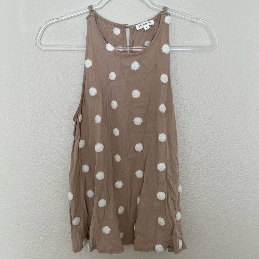 Tans and white tank top